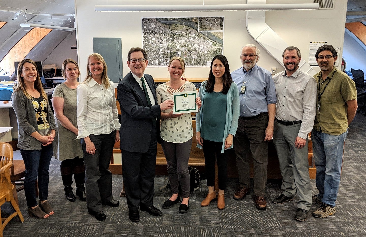 Campus Planning staff receive their award from UO President Michael Schill