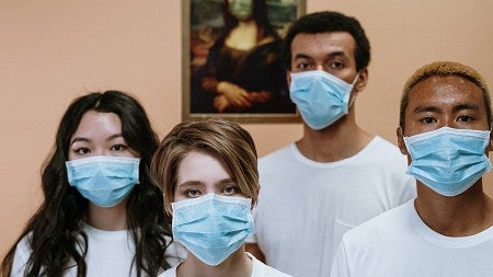 Young people wearing medical masks.