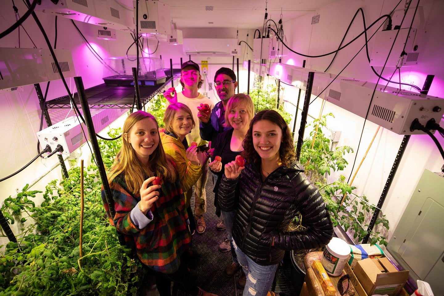 Students and Staff inside the Grow Pod with Plants
