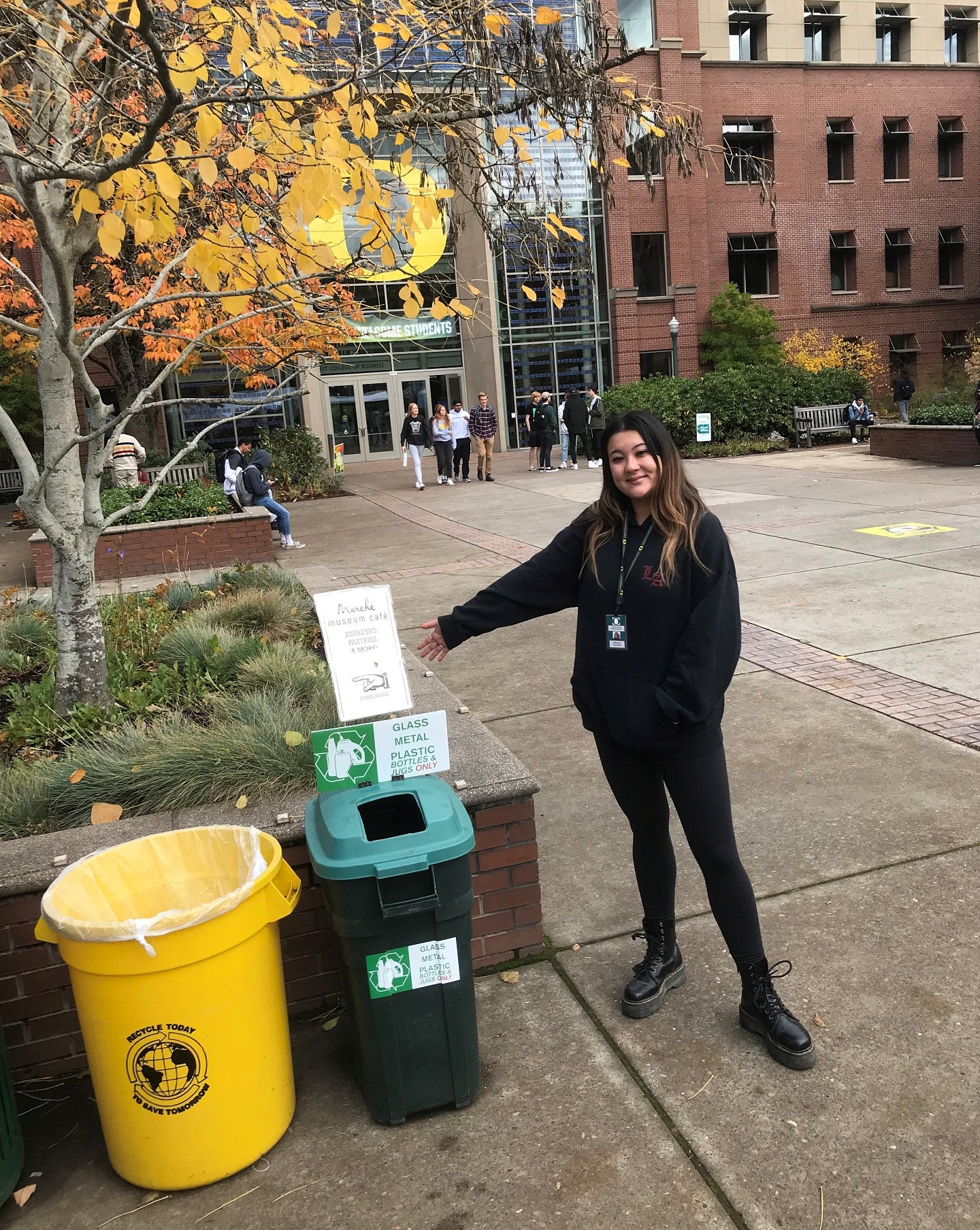 Student sustainability showing how to properly sort waste on campus.