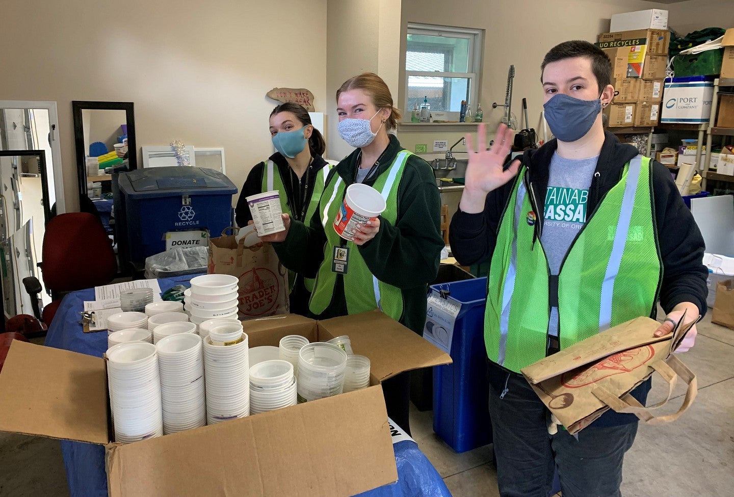 Student Sustainability Ambassadors help sort collected plastic materials for recycling.