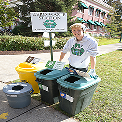 Zero Waste employee at an event materials station
