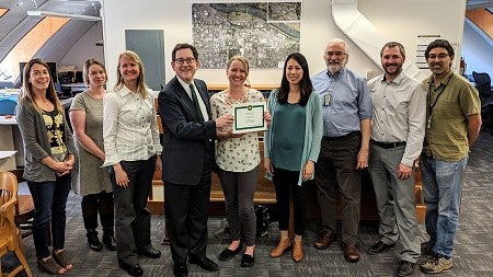 Campus Planning staff receive their award from UO President Michael Schill