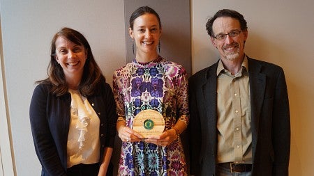 Excellence in Teaching 2019 winner Sarah Stapleton holds her award alongside TEP representatives.