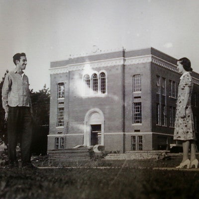 Chapman 1939  Hall construction with 2 people standing in the foreground.